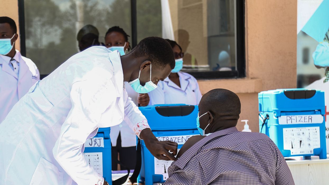 A medical officer administers a Covid-19 vaccine jab to a man at the Nakuru County Referral and Teaching Hospital in Kenya on June 6, 2022.