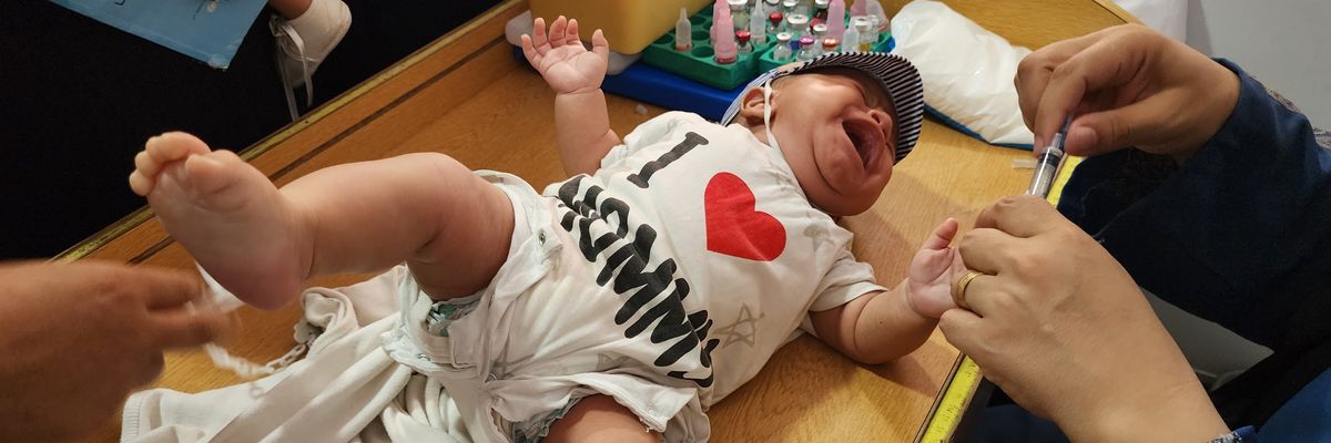 A medical team from the Palestinian Red Crescent administer the polio vaccine