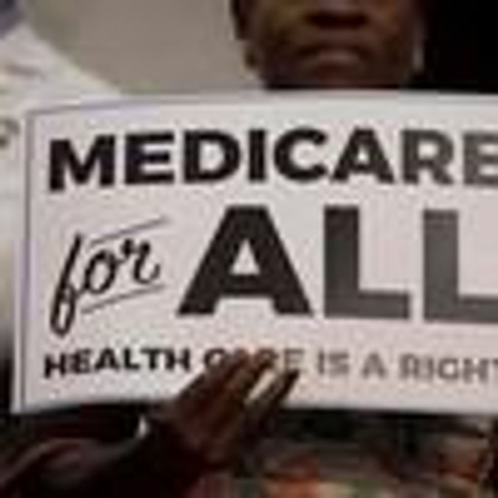 A Medicare for All supporter holds a sign on Capitol Hill.