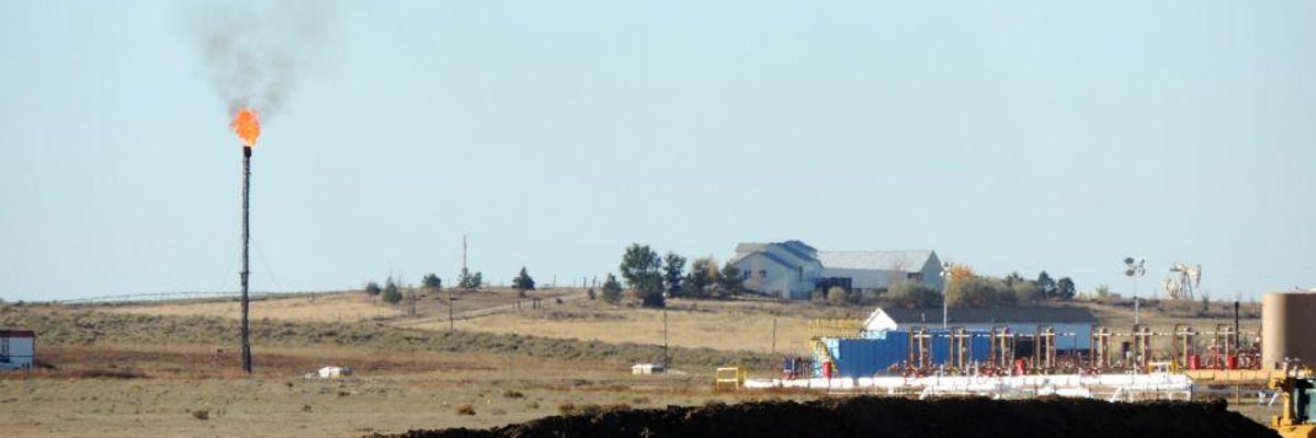 A methane flare is seen at a natural gas drilling site.