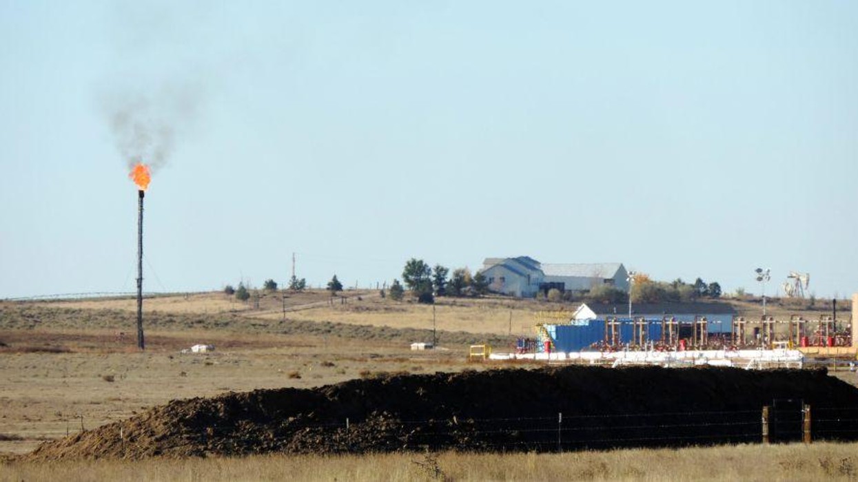 A methane flare is seen at a natural gas drilling site.