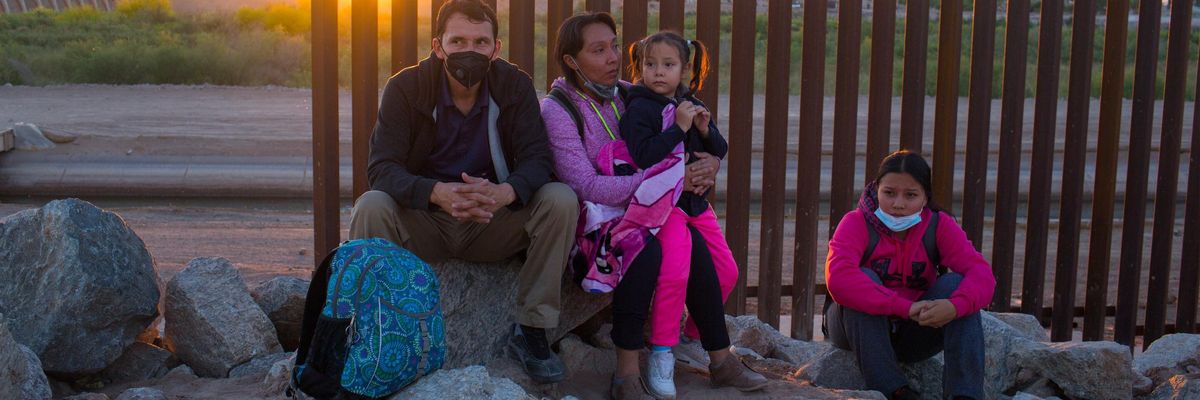 A migrant family from Central America waits to be processed by the U.S. Border Patrol.