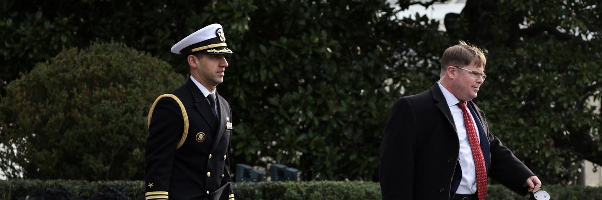 A military aide carries the so-called "nuclear football"