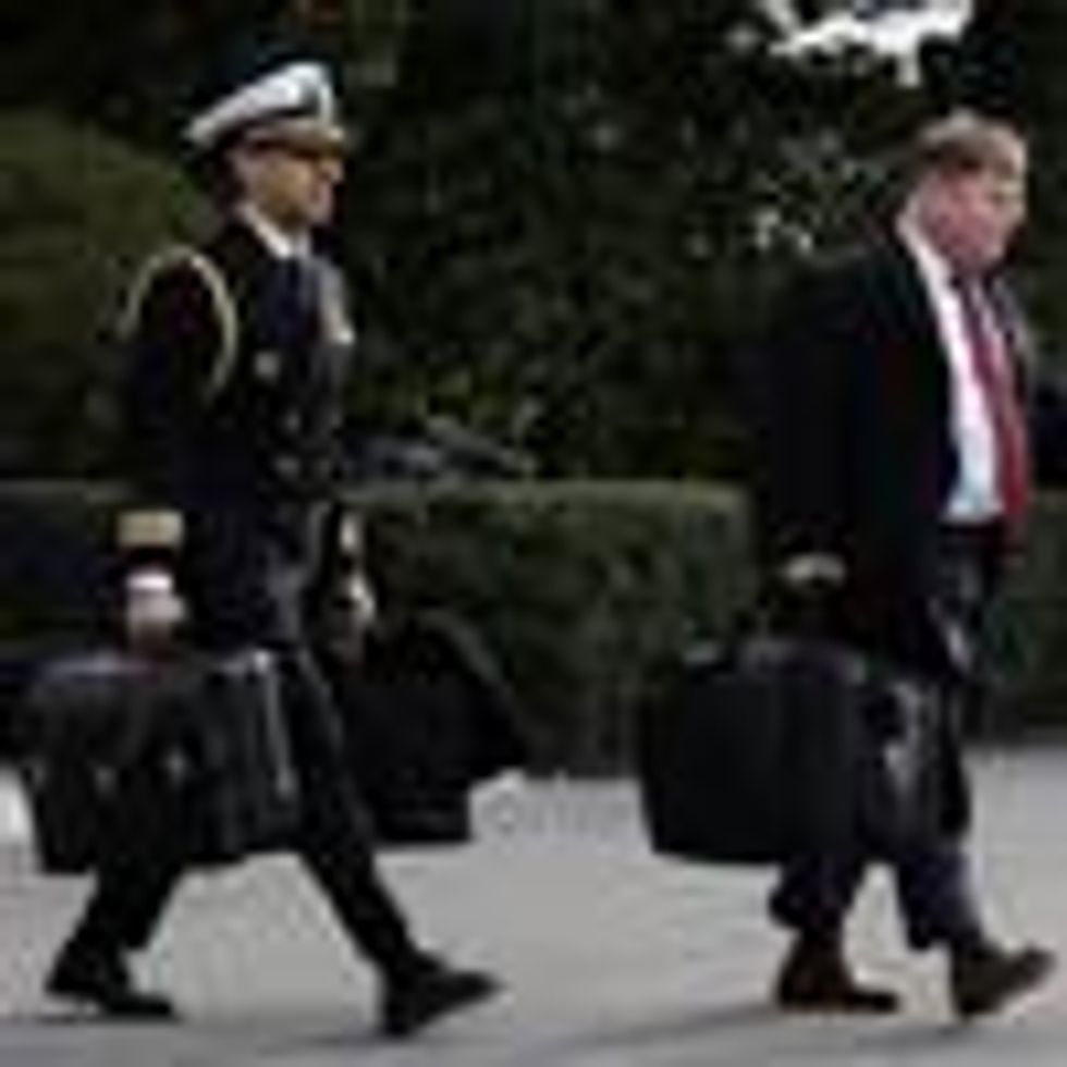 A military aide carries the so-called