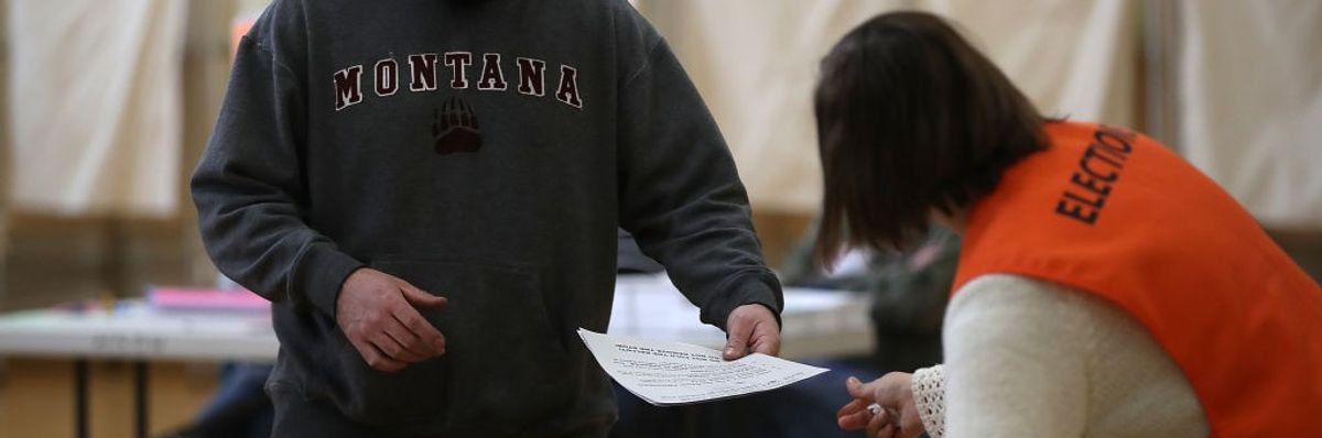 A Montana voter prepares to cast his ballot