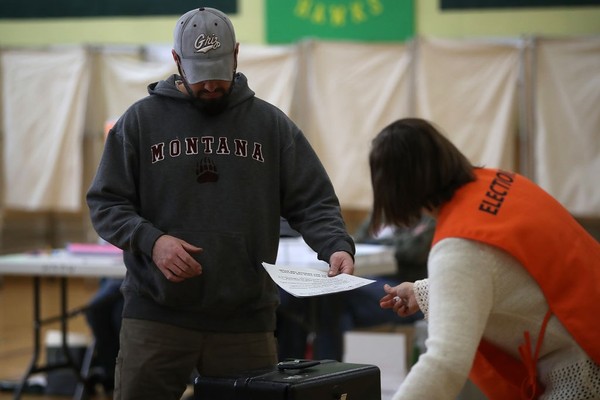 A Montana voter prepares to cast his ballot