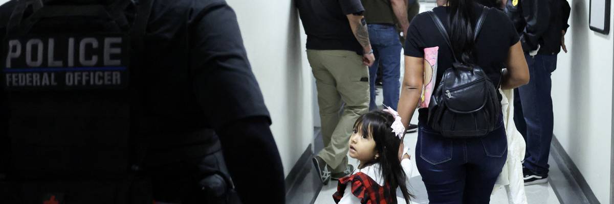 A mother and child at an immigration court.