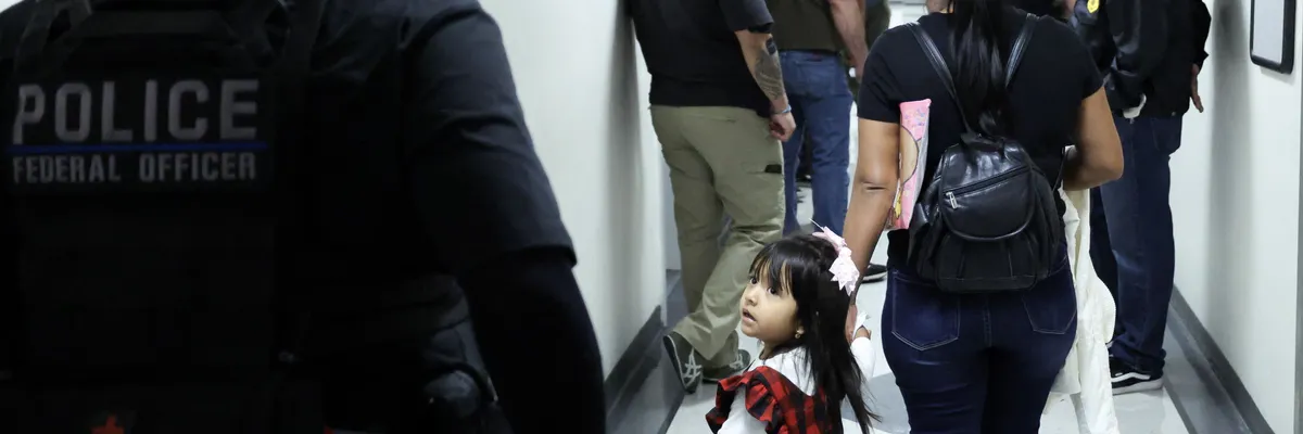 A mother and child at an immigration court.