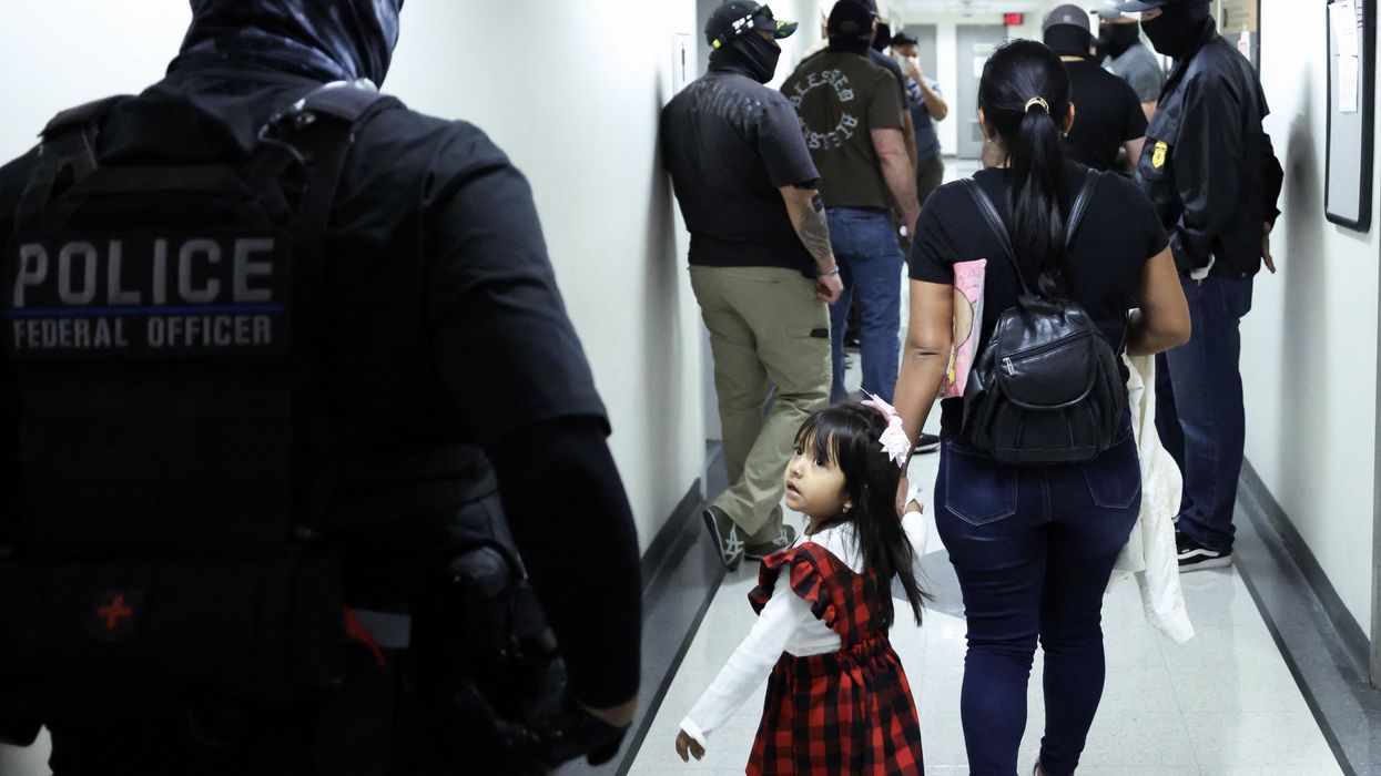 A mother and child at an immigration court.