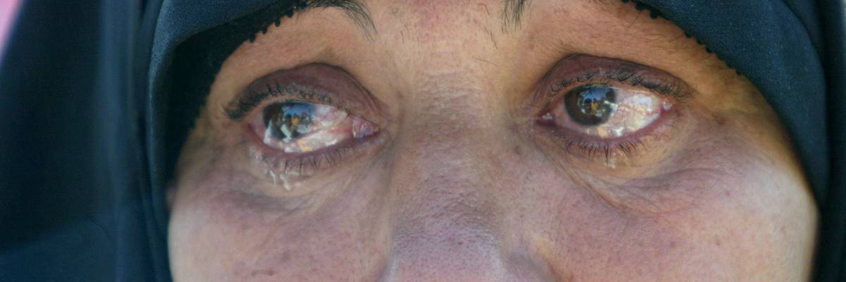 A mother cries after learning that her son Mohammed Nasr was not released along with others from the Abu Ghraib prison in Iraq