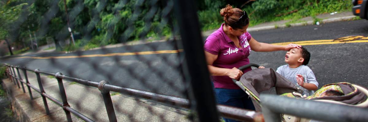 A mother drops children off at Head Start.