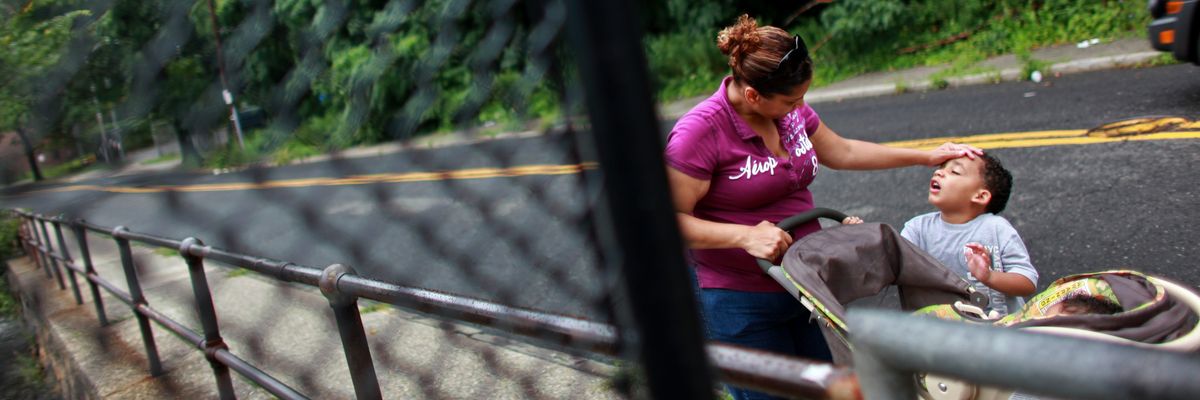 A mother drops children off at Head Start.