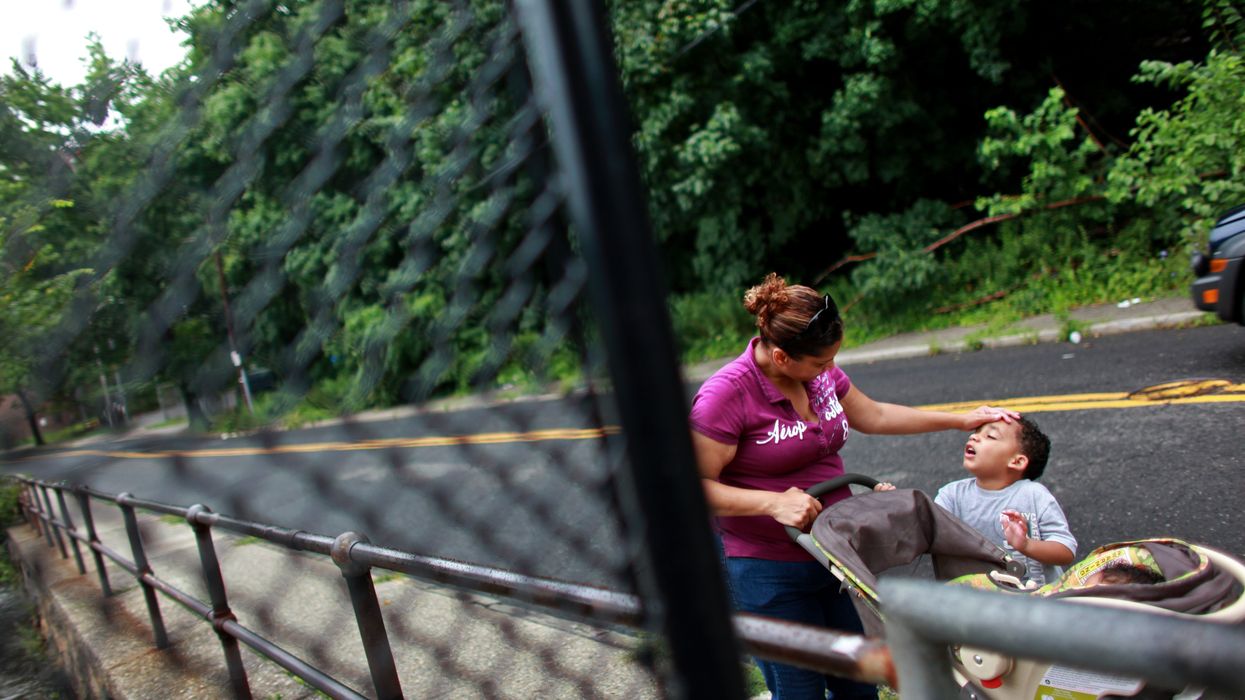 A mother drops children off at Head Start.