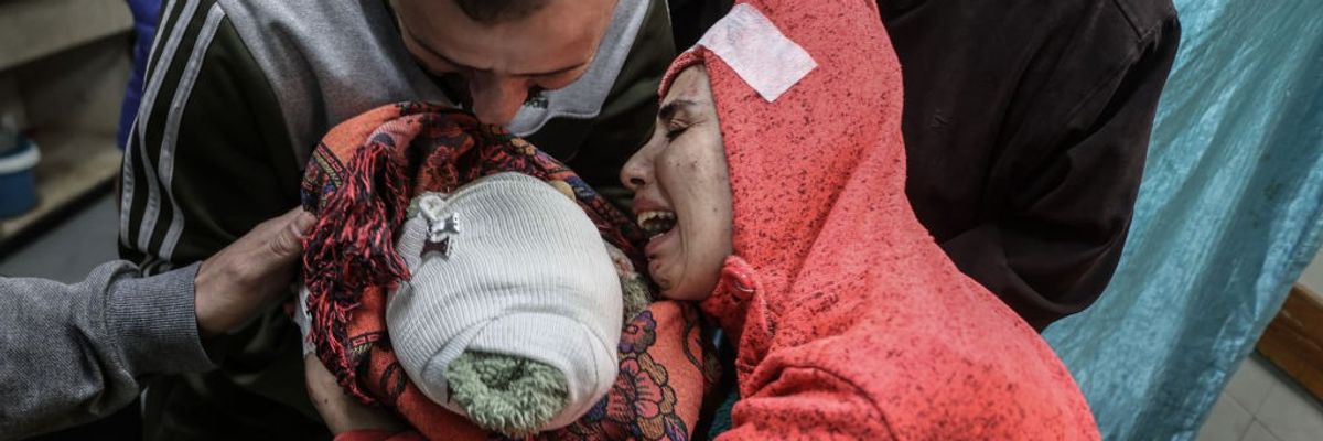 A mother mourns after her child was killed by an Israeli airstrike