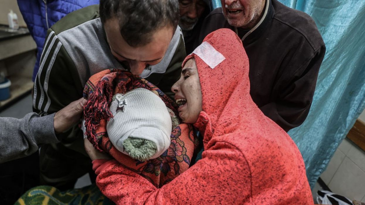 A mother mourns after her child was killed by an Israeli airstrike