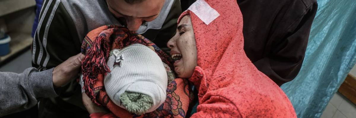 A mother mourns for her baby killed by an Israeli airtstrike