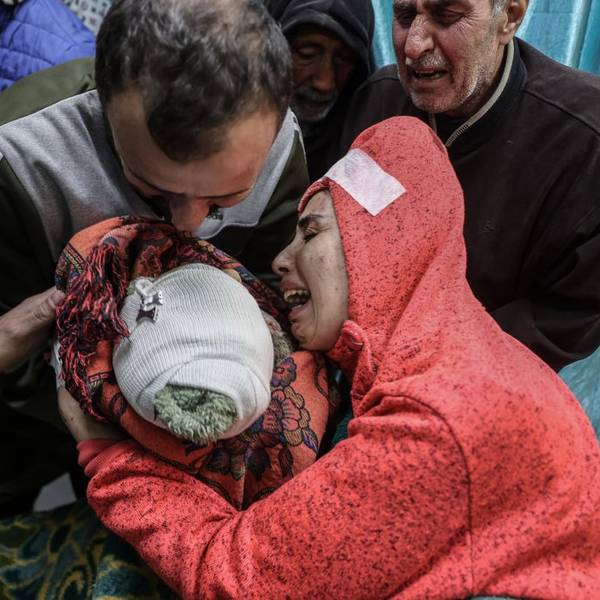 A mother mourns for her baby killed by an Israeli airtstrike