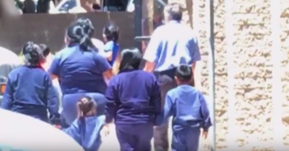 A neighbor filmed children being taken into a vacant office building in Phoenix, Arizona, and showed the footage to reporters when she suspected the children were immigrants who had been detained and possibly separated from their parents. (Photo: Reveal/YouTube)