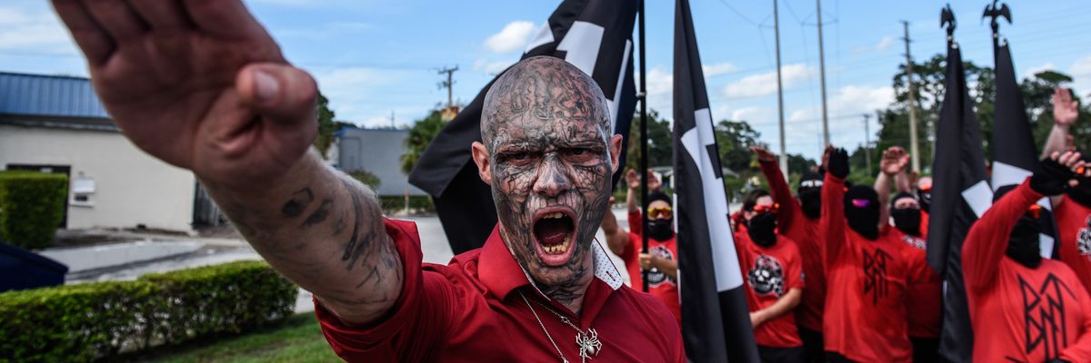 A neo-Nazi does a Hitler salute at a fascist Red Shirts March in Florida last weekend
