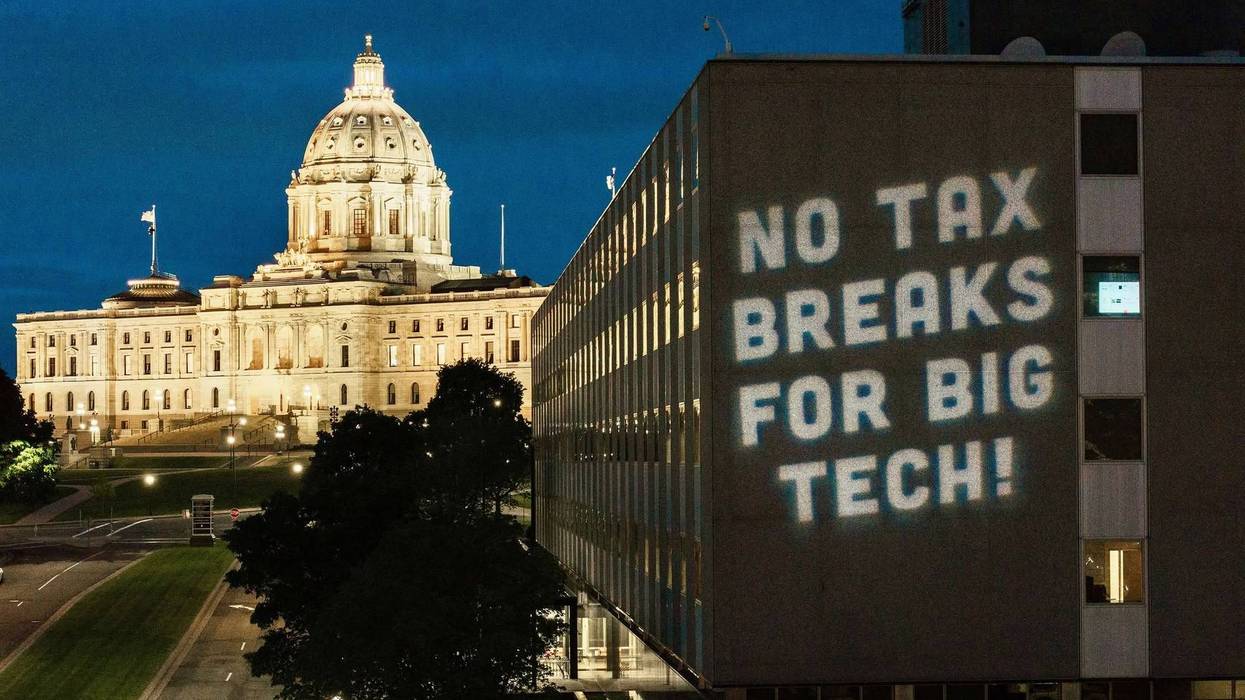 A 'No Tax Breaks for Big Tech!" projection in front of the Minnesota state House.