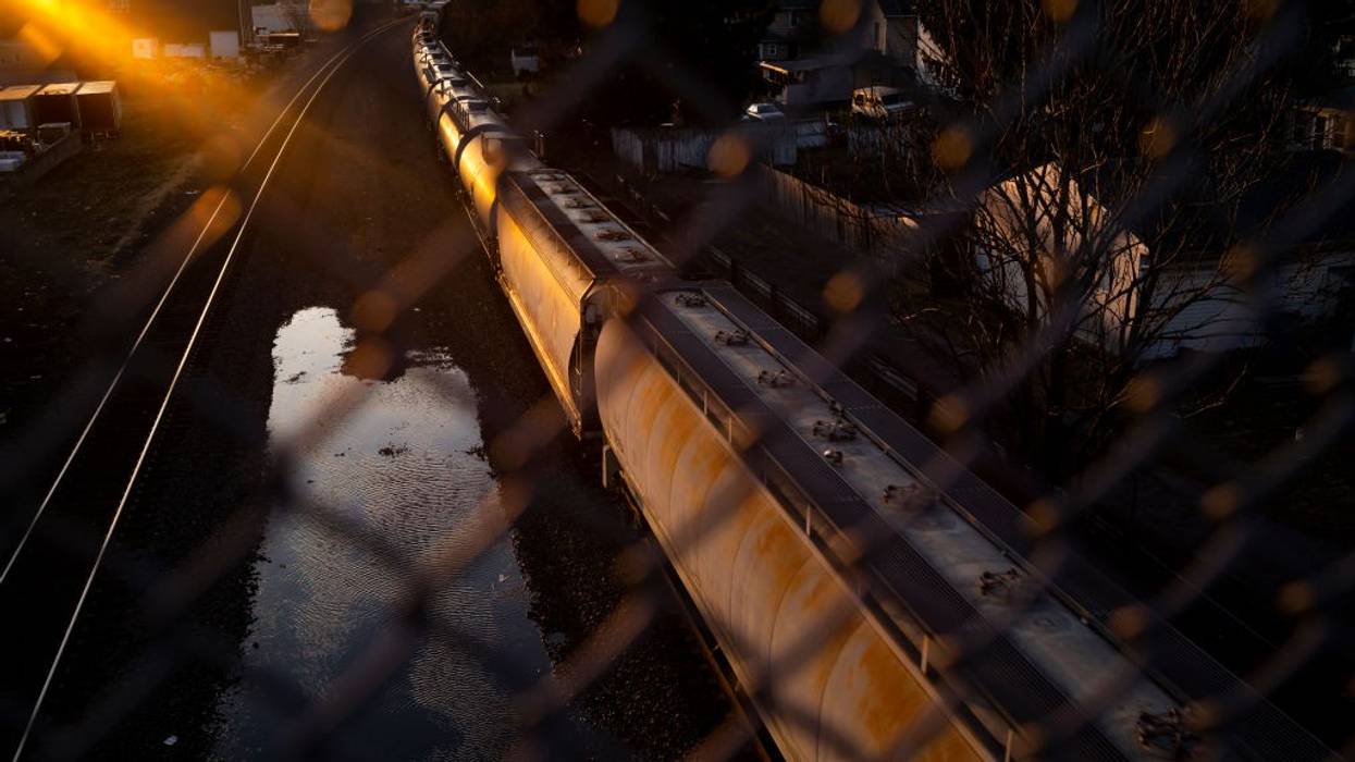 A Norfolk Southern train passes underneath a bridge on February 25, 2023 in East Palestine, Ohio.