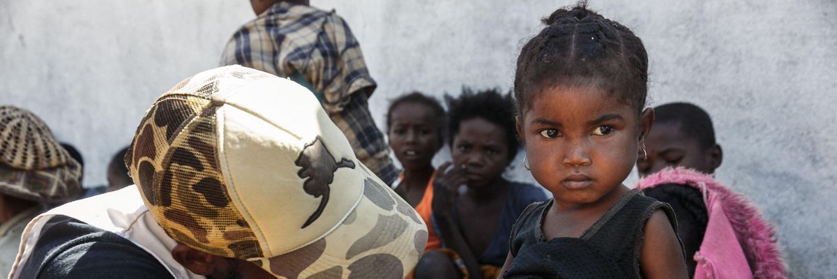 A nurse from a Doctors Without Borders mobile clinic set up to treat the most serious cases of malnutrition in southern Madagascar inspects a child in the village of Befeno on September 2, 2021.