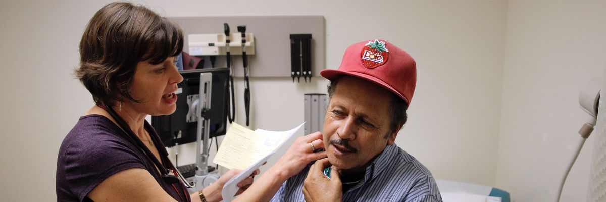 A nurse practitioner gives a patient a check-up