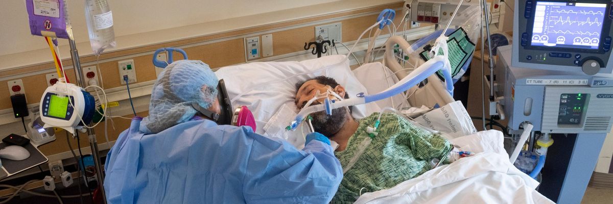 A nurse treats a coronavirus patient
