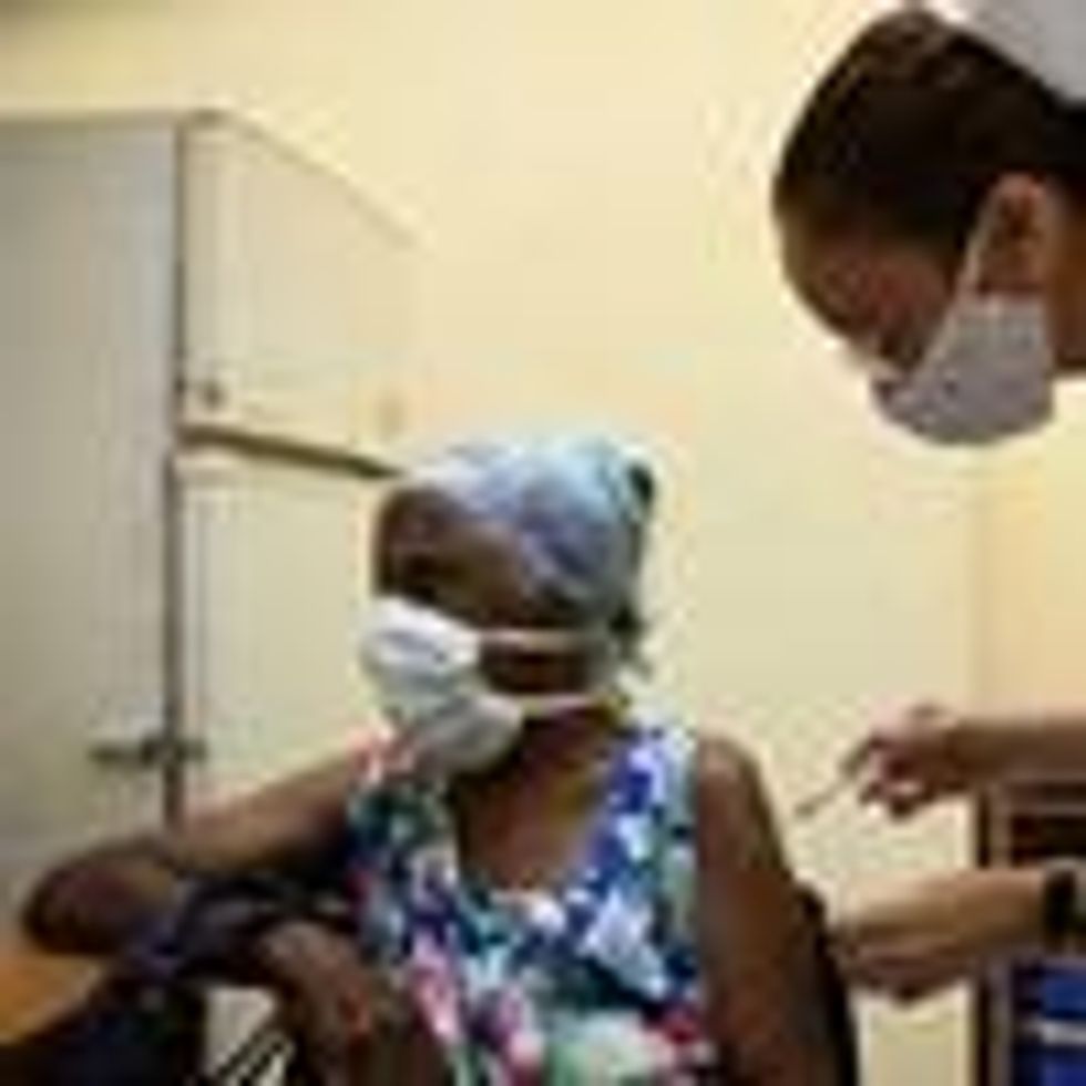 A nurse vaccinates an elderly woman against Covid-19 with Cuban vaccine Abdala in Havana on August 2, 2021