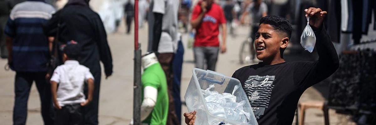 A Palestinian Boy Sells Water in Gaza