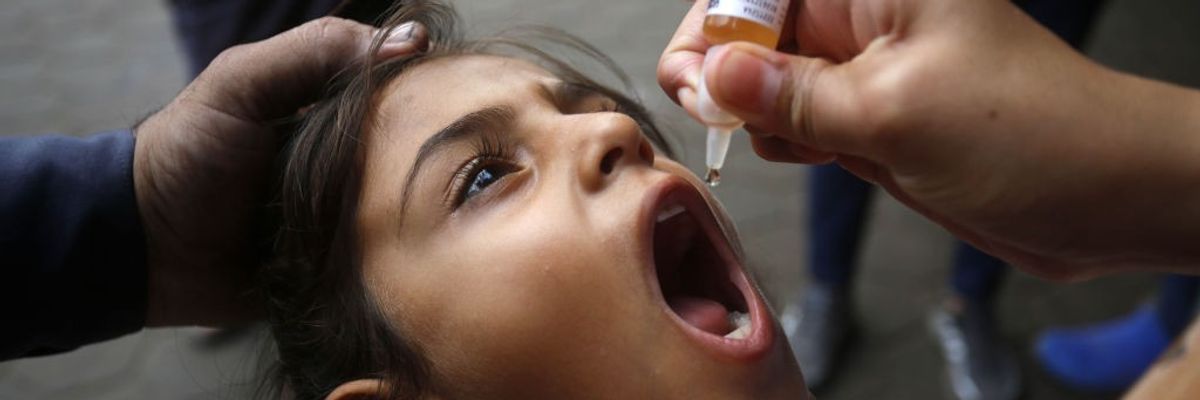 A Palestinian girl received a polio vaccine dose