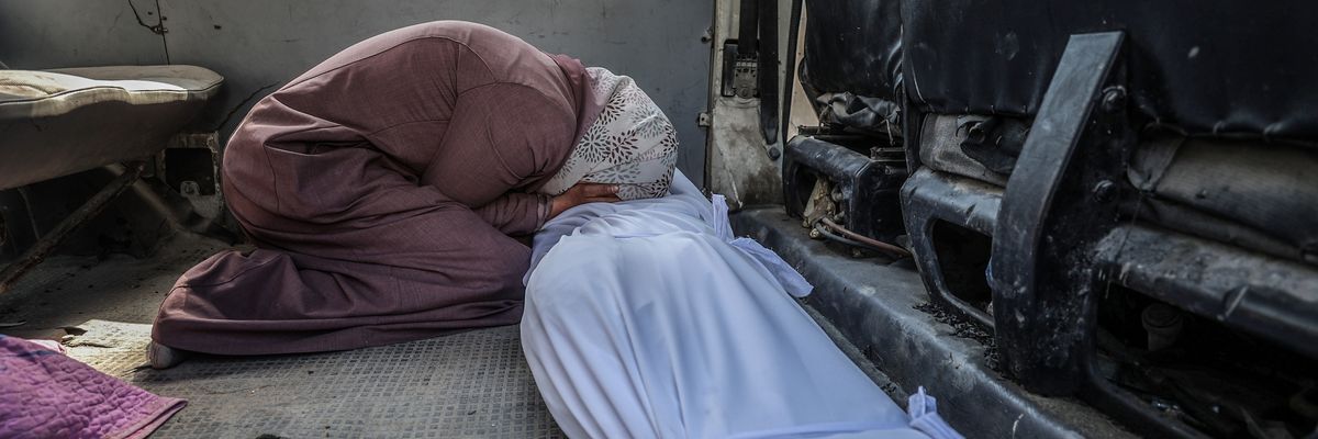 A Palestinian woman mourns people killed in an Israeli attack