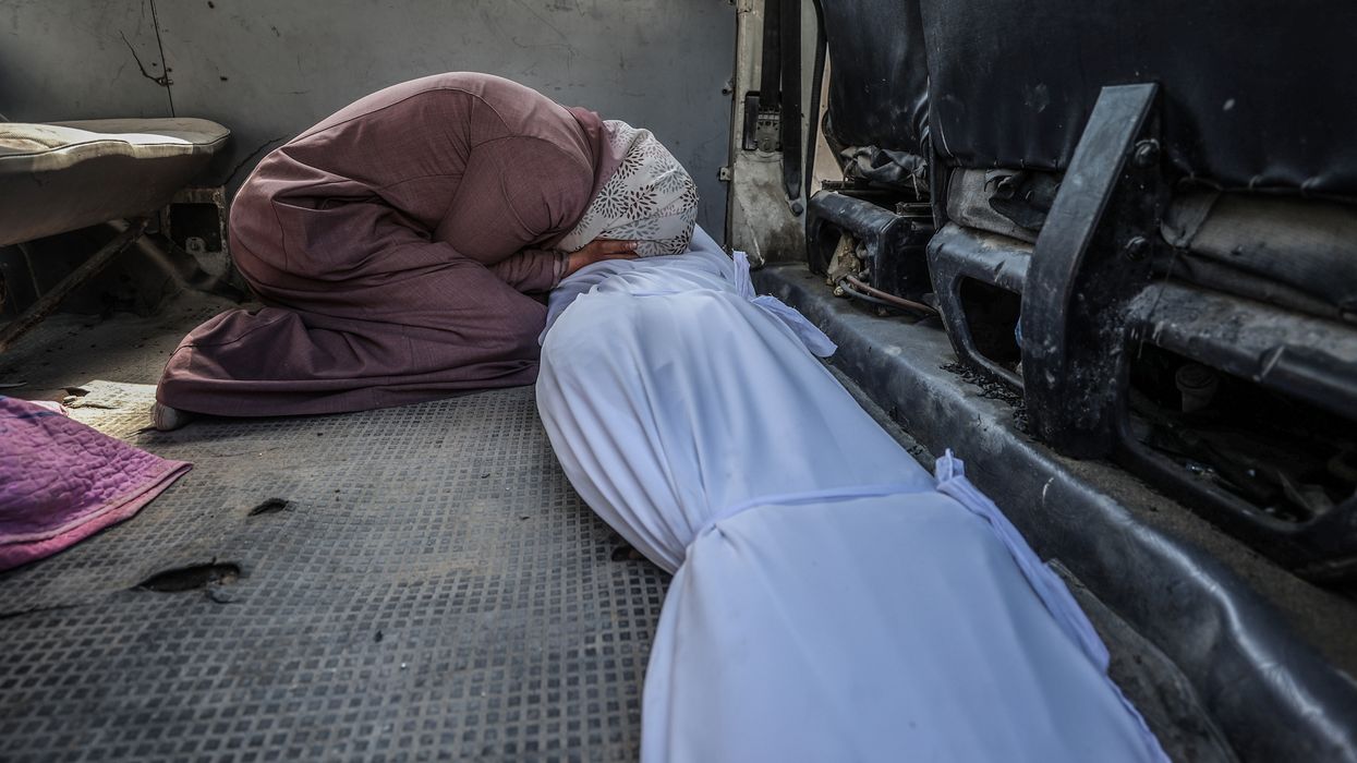 A Palestinian woman mourns people killed in an Israeli attack