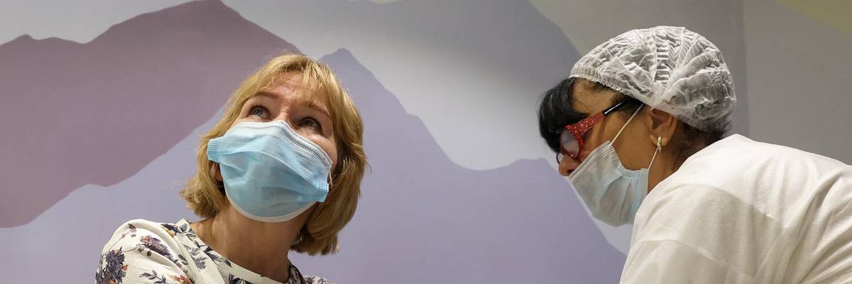 A patient receives a vaccine dose