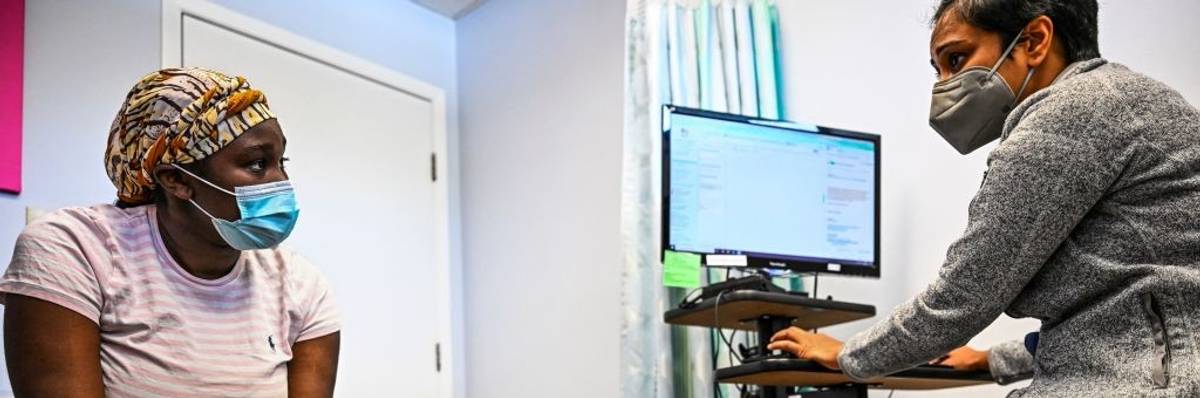 A patient talks with her doctor at a Planned Parenthood clinic in Jacksonville