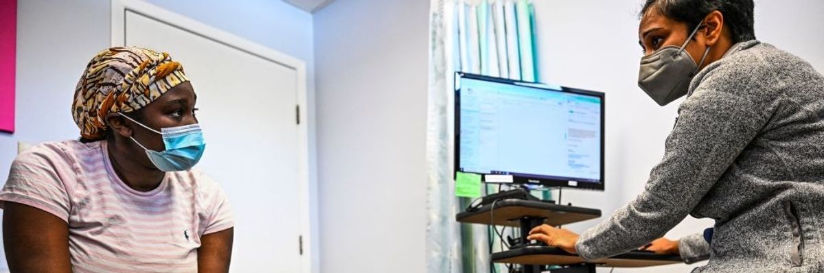 A patient talks with her doctor at a Planned Parenthood clinic in Jacksonville