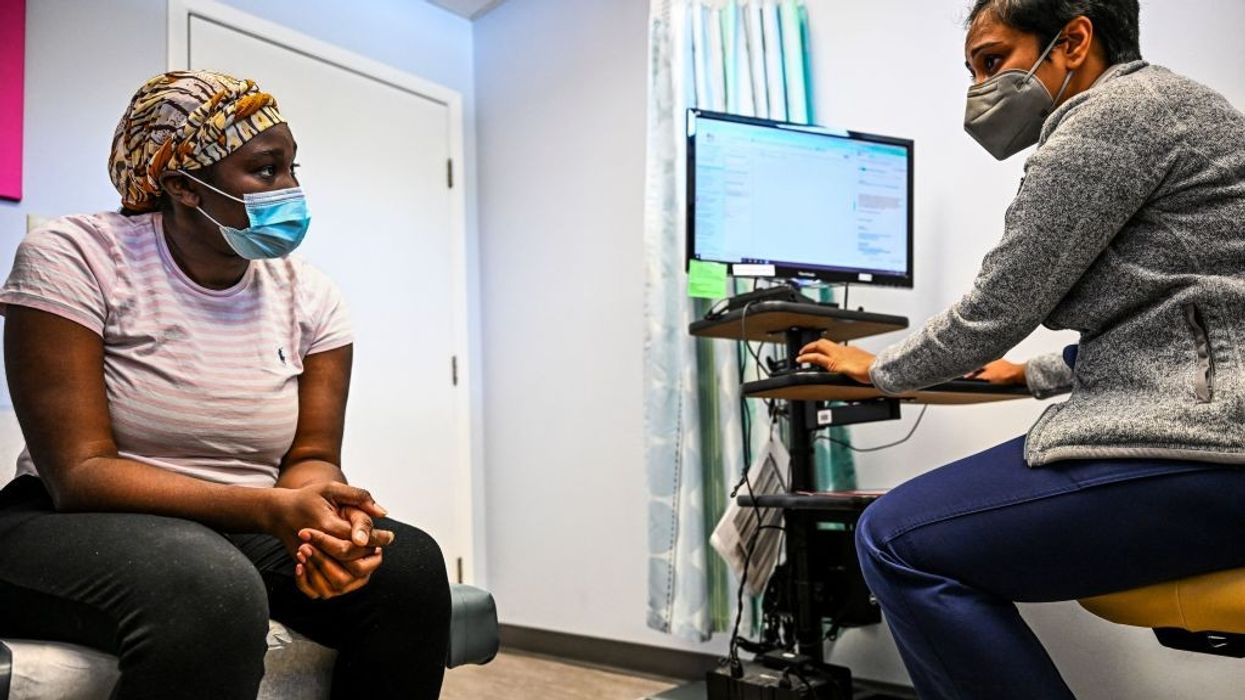 A patient talks with her doctor at a Planned Parenthood clinic in Jacksonville