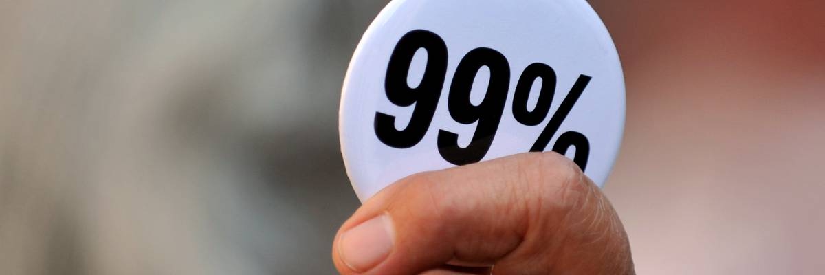 A person holds a 99% button.