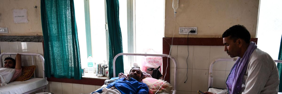 A person in India is hospitalized on June 4, 2019 after suffering heat stroke amid temperatures of 50°C (122 °F) in Churu, a city in the state of Rajasthan. (Photo: Money Sharma via Getty Images)