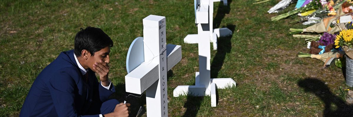 A person mourns a victim of the school shooting in Nashville