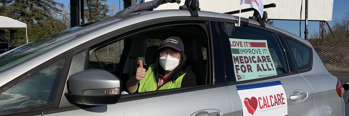 A person takes part in a January 8, 2022 caravan in Sacramento, part of a multi-city event nurses with the California Nurses Association organized across the state to demand that the state adopt the California Guaranteed Healthcare for All Act, AB 1400. (Photo: California Nurses Association/CNA)