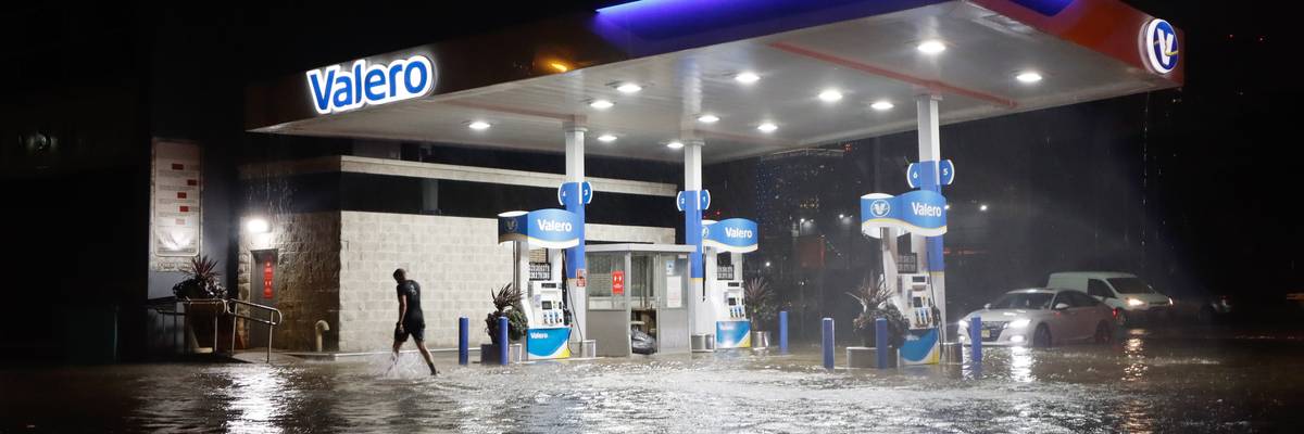 A person walks through floodwaters on Newark Street caused by the remnants of Hurricane Ida on September 1, 2021 in Hoboken, New Jersey.
