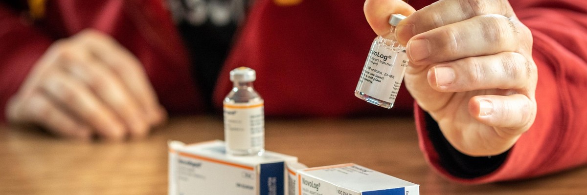 A person with diabetes looks at insulin