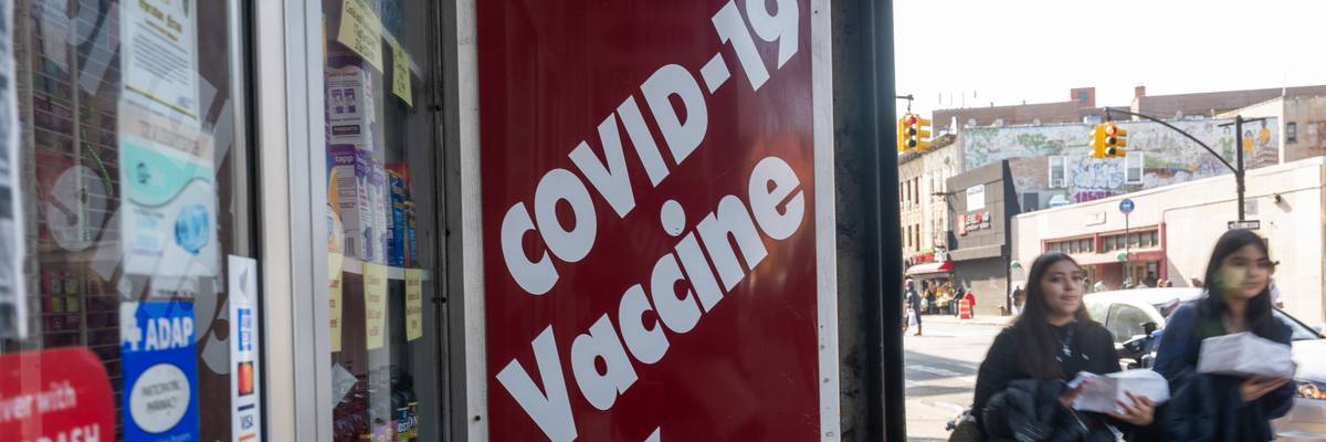 A pharmacy advertises the Covid-19 vaccine as the nation marks the fifth anniversary of the Covid-19 pandemic