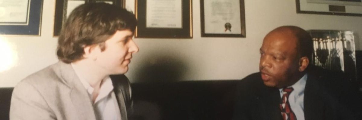 A photo from John Dear's meeting with Rep. John Lewis in 1995.