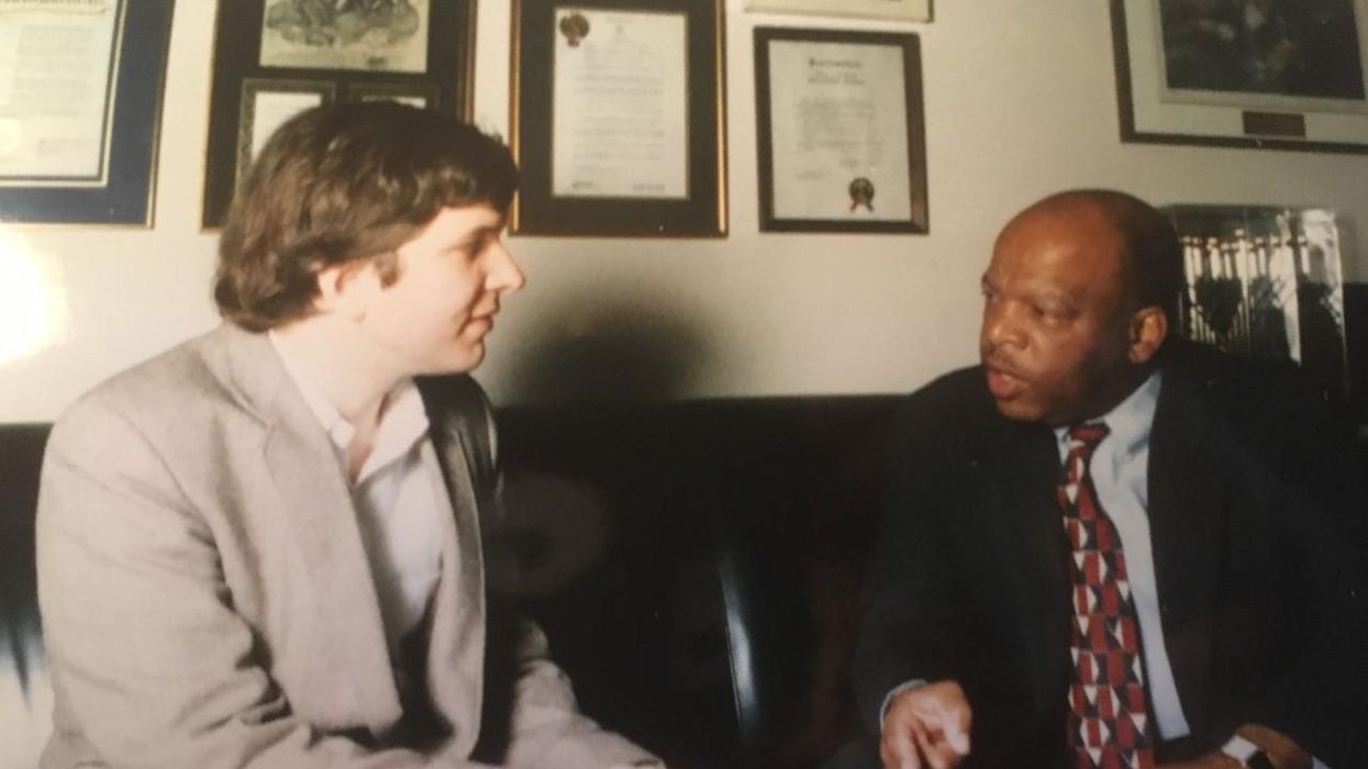 A photo from John Dear's meeting with Rep. John Lewis in 1995.