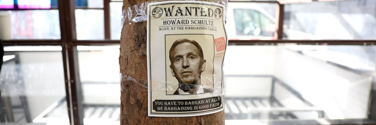 A photo of Starbucks interim CEO Howard Schultz is posted on a tree as striking Starbucks workers picket outside of a Starbucks coffee shop during a national strike on November 17, 2022 in San Francisco, California.