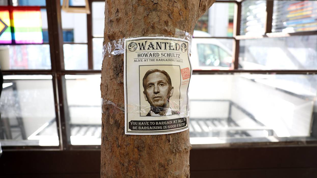 A photo of Starbucks interim CEO Howard Schultz is posted on a tree as striking Starbucks workers picket outside of a Starbucks coffee shop during a national strike on November 17, 2022 in San Francisco, California.