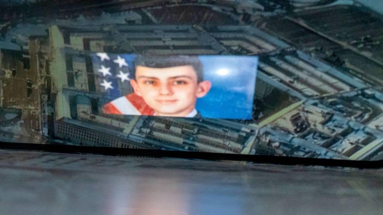 A picture of Jack Teixeira super-imposed on the Pentagon.