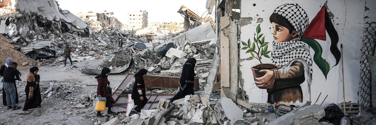 A picture painted on the rubble of houses by a Palestinian artist